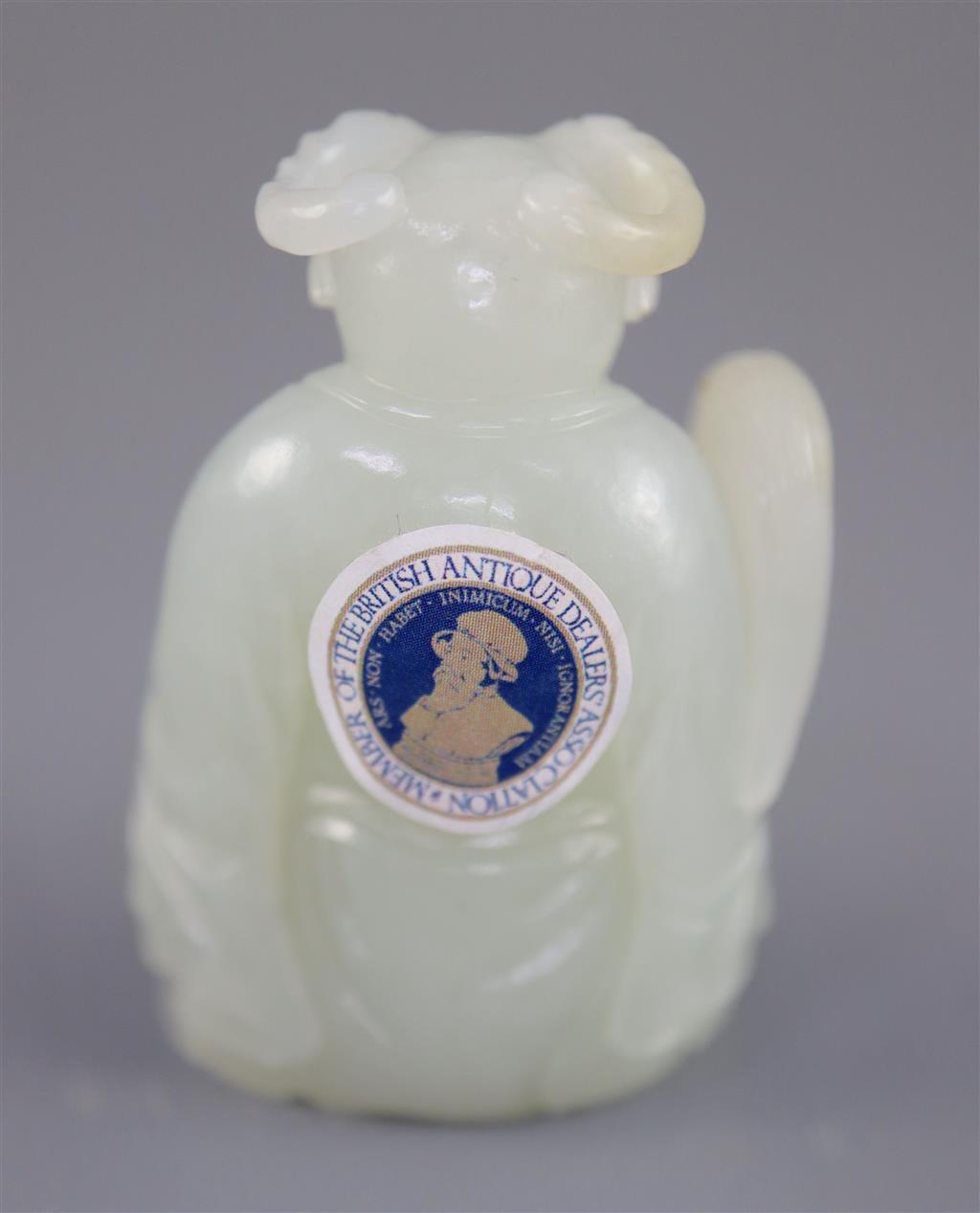 A Chinese pale celadon jade seated figure of a ram-headed immortal, 4.9cm high